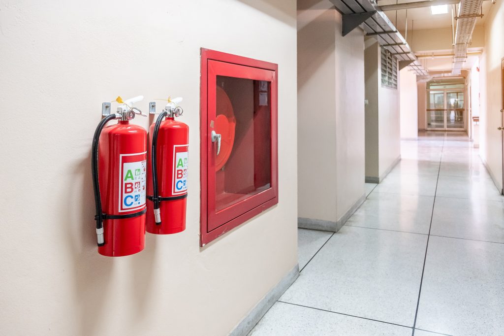 Fire extinguisher system on the wall background,